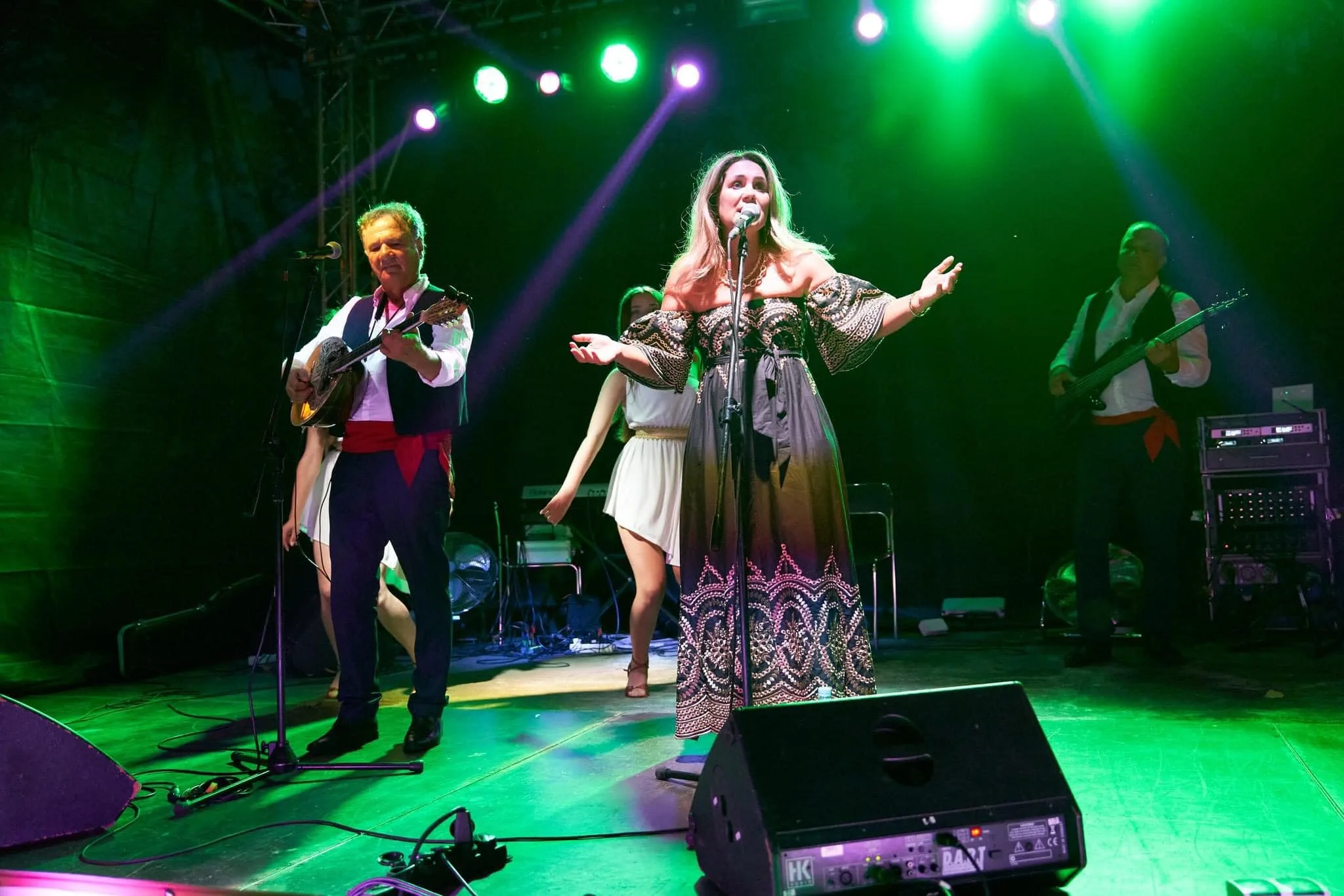 Mythos vocalist and bouzouki on stage