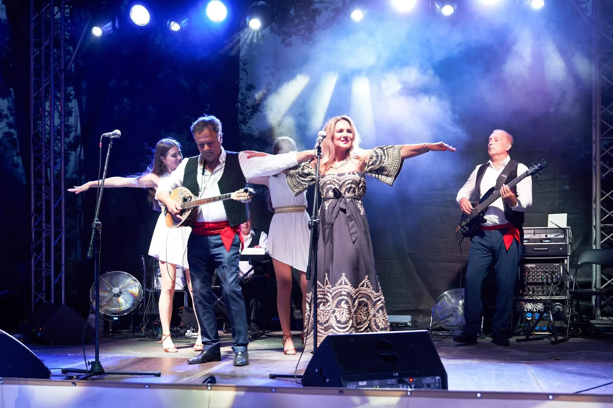 Mythos Greek band performing live on stage with bouzouki