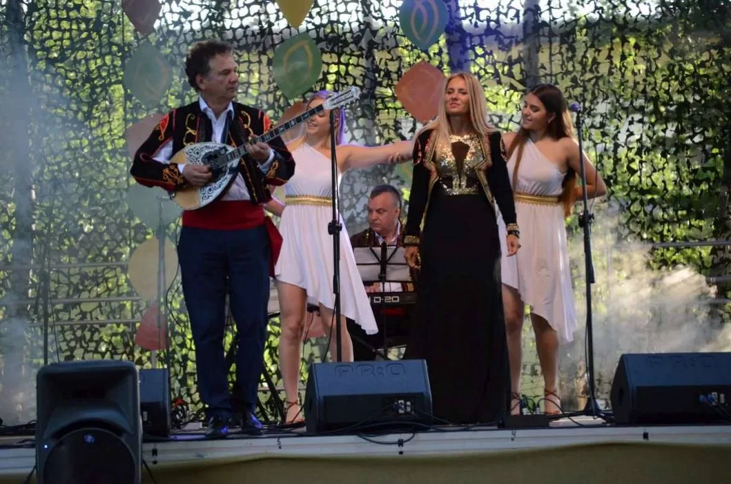 Mythos Greek band performing live at outdoor festival